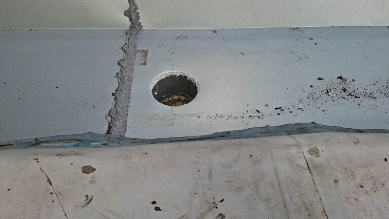 New box gutter with outlet installed along the side of the building