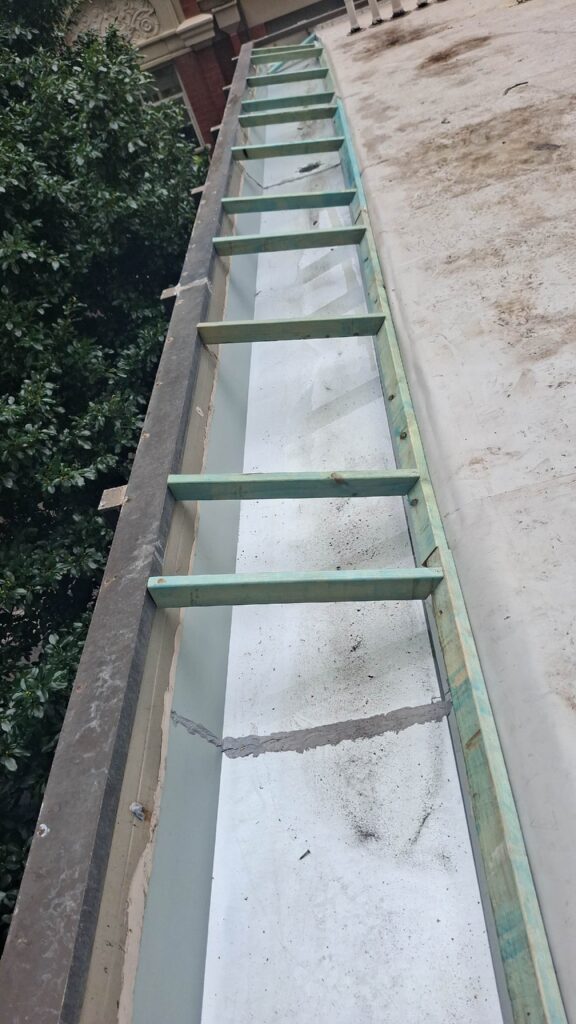 New box gutter and parapet wall flashing installed