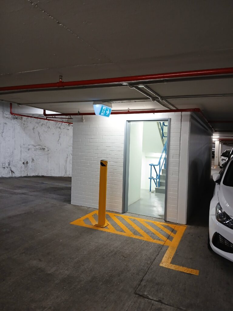 Car park lift lobby entry with new yellow line marking and repainted walls