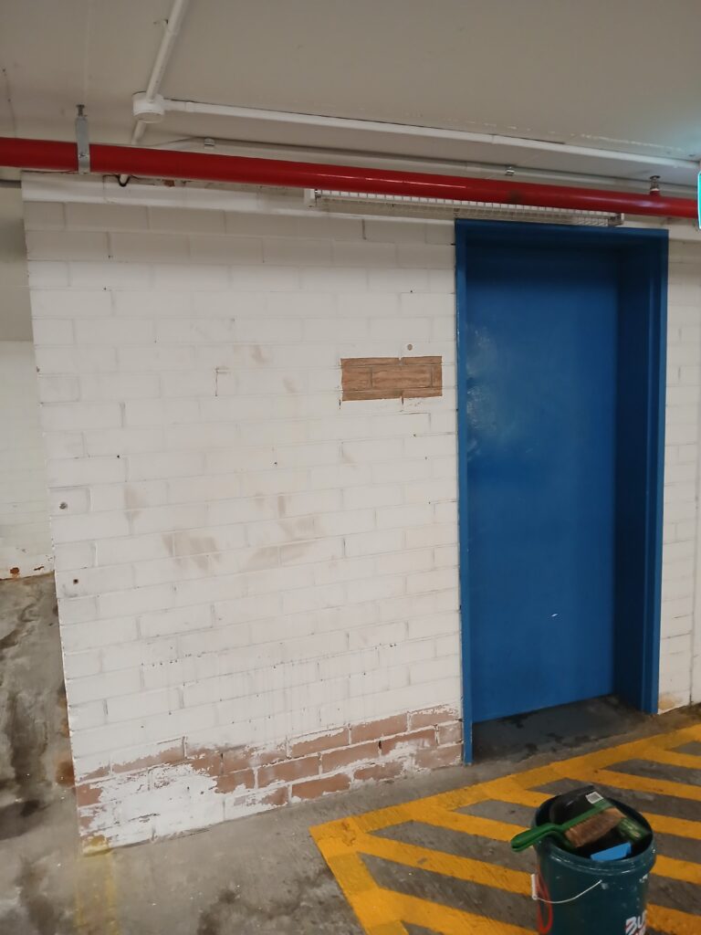 Car park lift lobby with repainted walls and doors