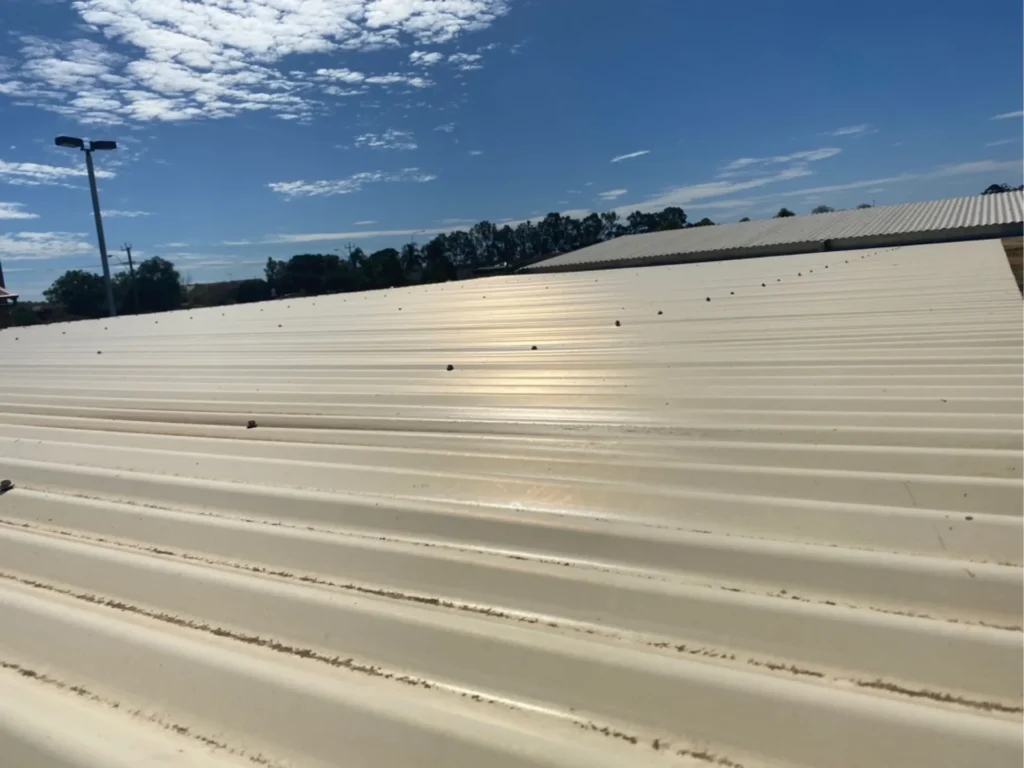 Faded original car park shade structure roof sheets before replacement