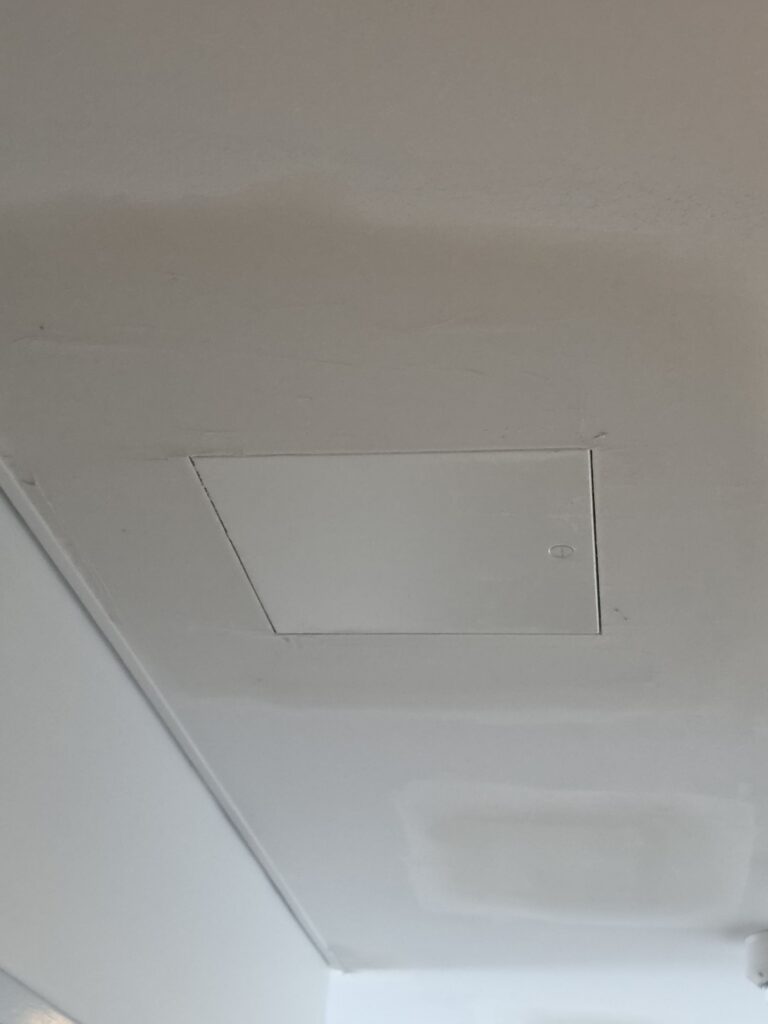 New ceiling access panel installed in a commercial building