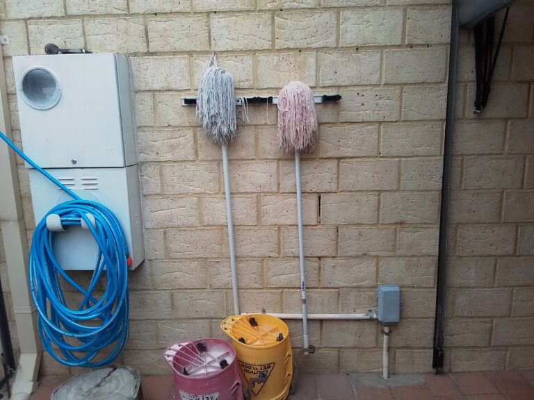 Completed canopy shelf above an outdoor cleaning equipment area