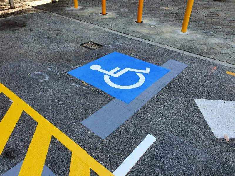 Car park accessible bay and loading zone line marking at a Perth university campus
