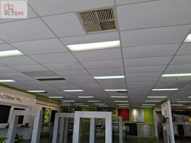 Reinstated suspended ceiling with lighting and air vent left in place