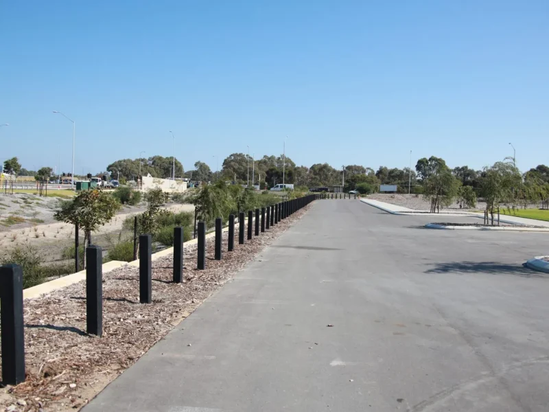 ctbm-black-timber-bollards-along-car-park-edge.webp