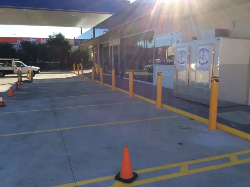ctbm-yellow-bollards-and-bay-lines-petrol-station-store-frontage.webp