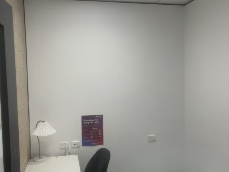 Library room walls before patching and repainting